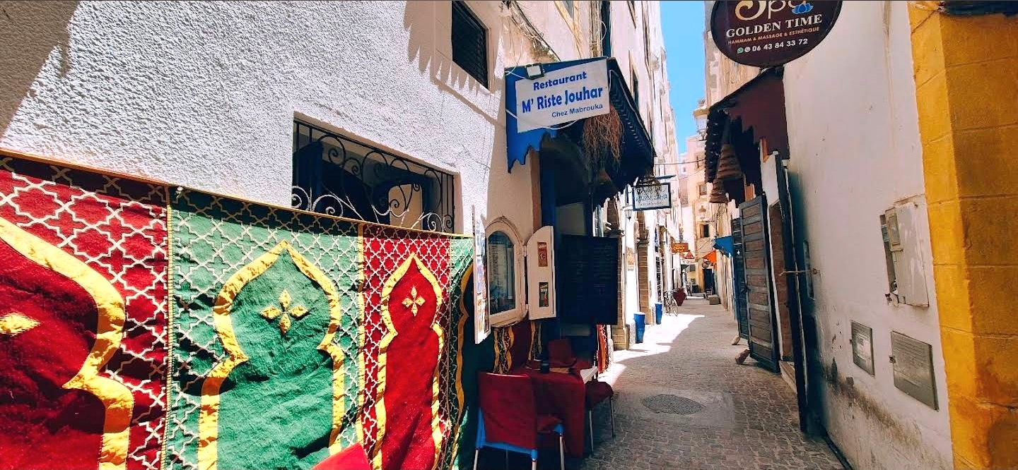 Narrow Medina lane leading to the restaurant entrance