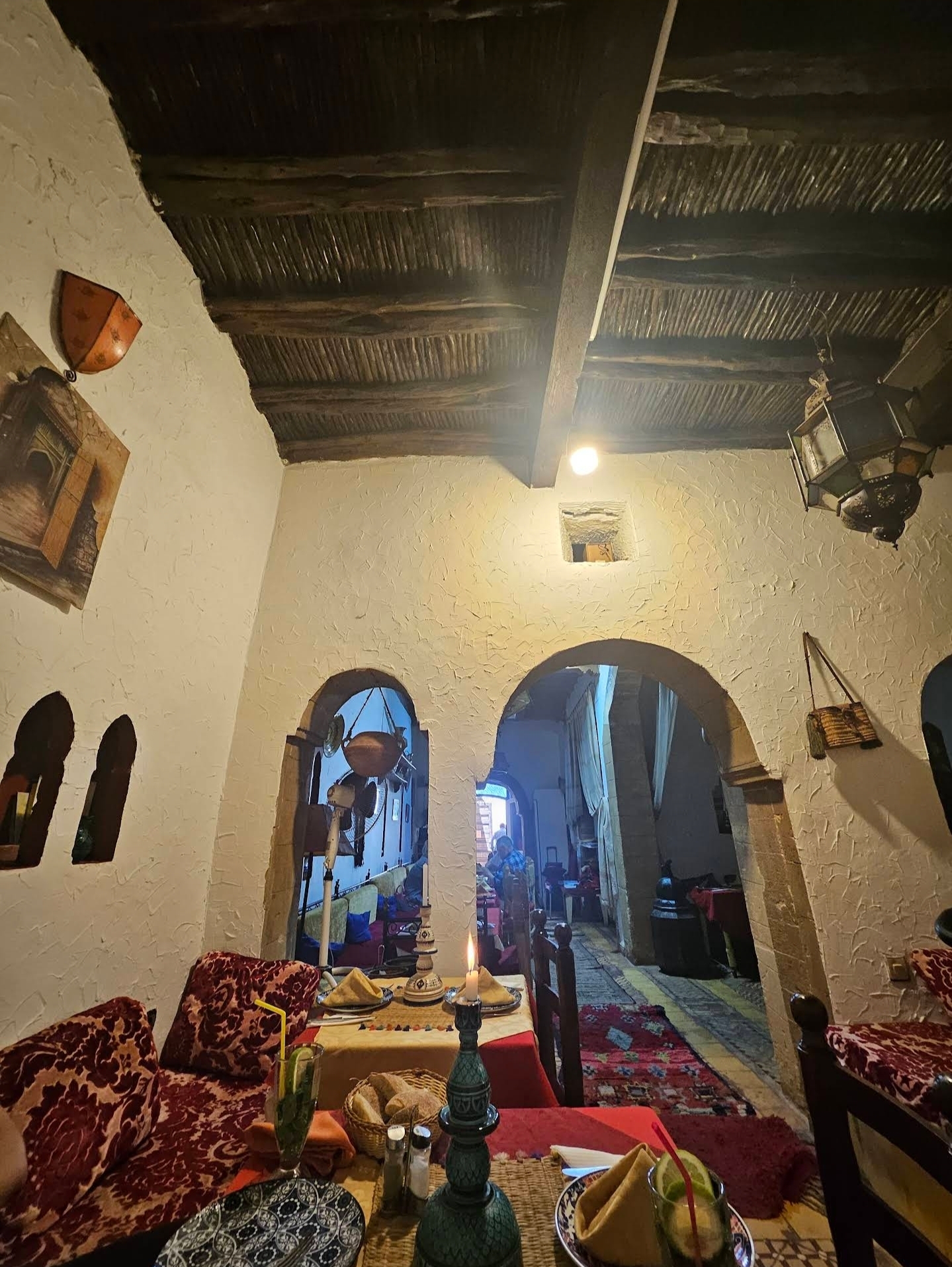 Dining alcove framed by sculpted Moorish arches