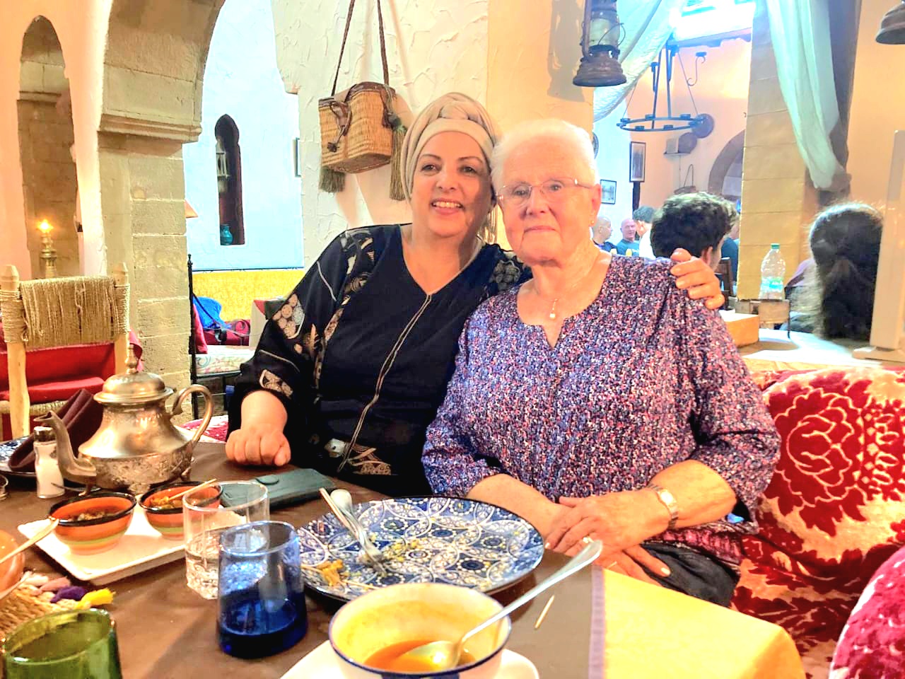 Two guests enjoying a glass of Moroccan mint tea
