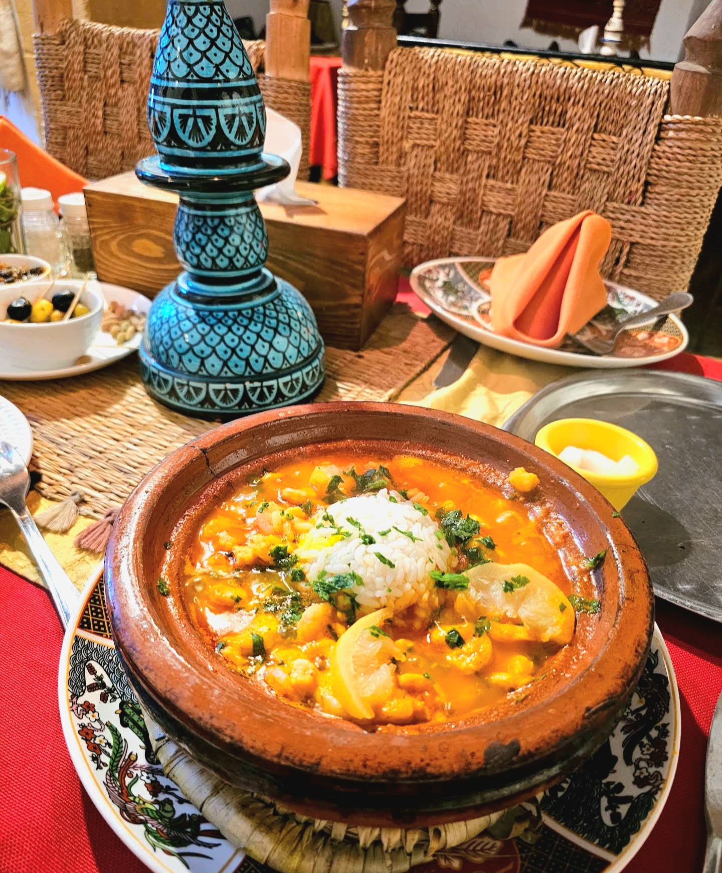 Table set with hand-painted Moroccan ceramics and linen