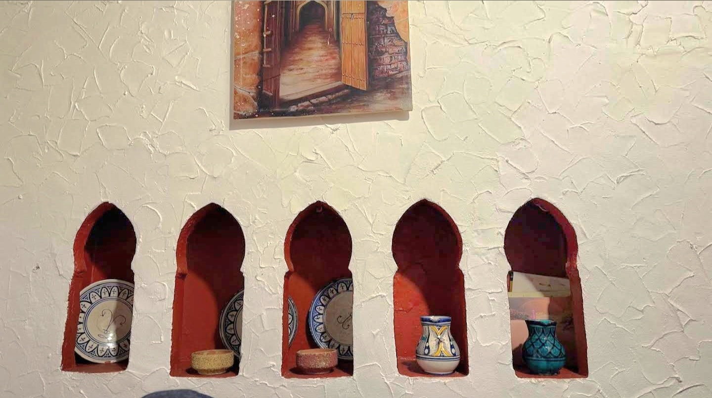 Hand-carved plaster niches in traditional Moroccan walls